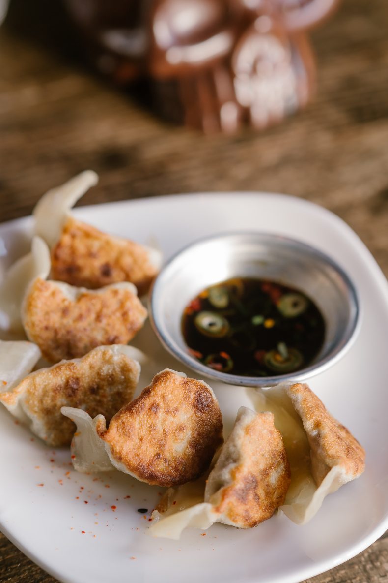Pan-fried gyoza with dipping sauce