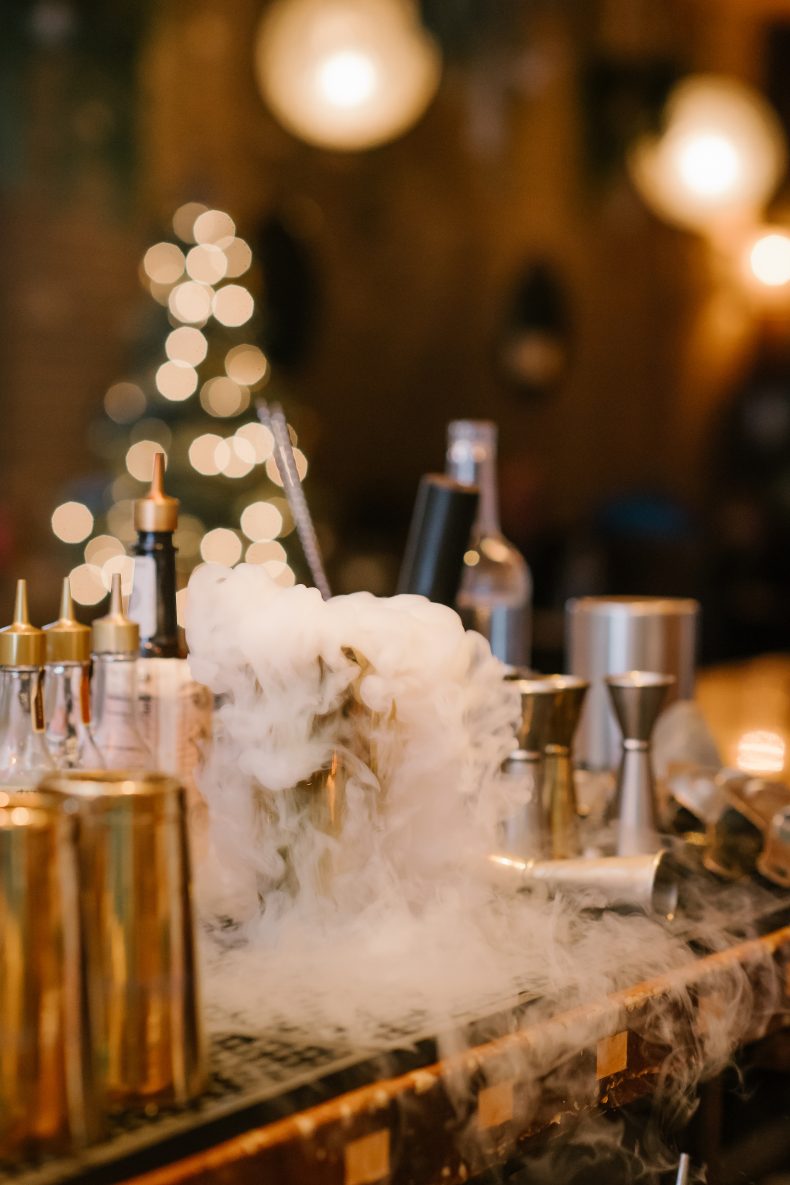 Cocktails smoking with dry ice on the bar